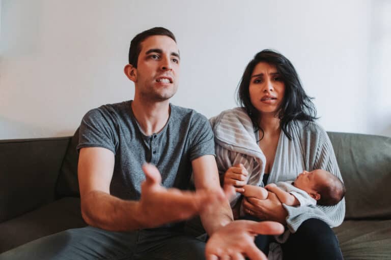 Two young parents with a baby