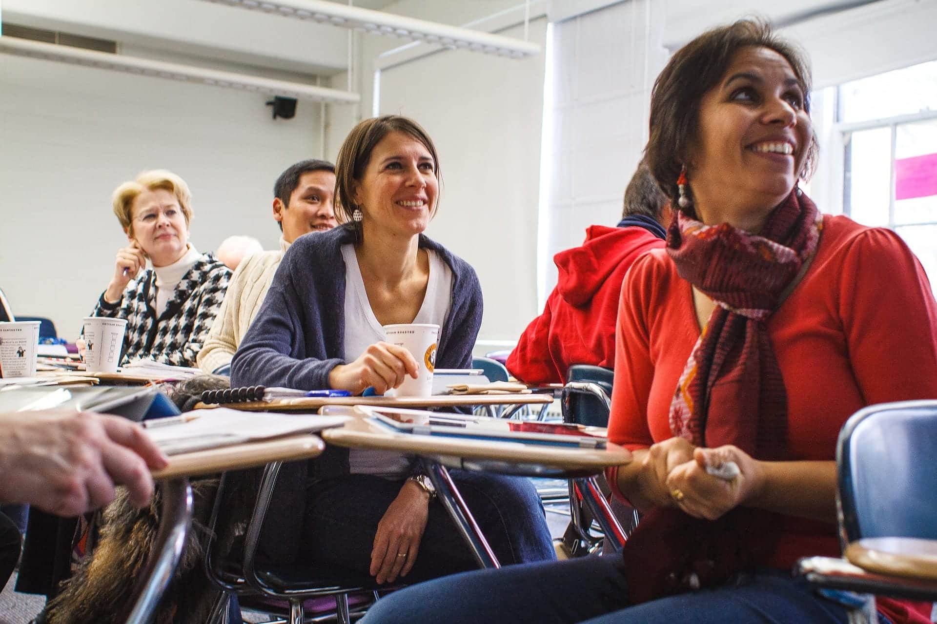 A class of adult learners looking attentive