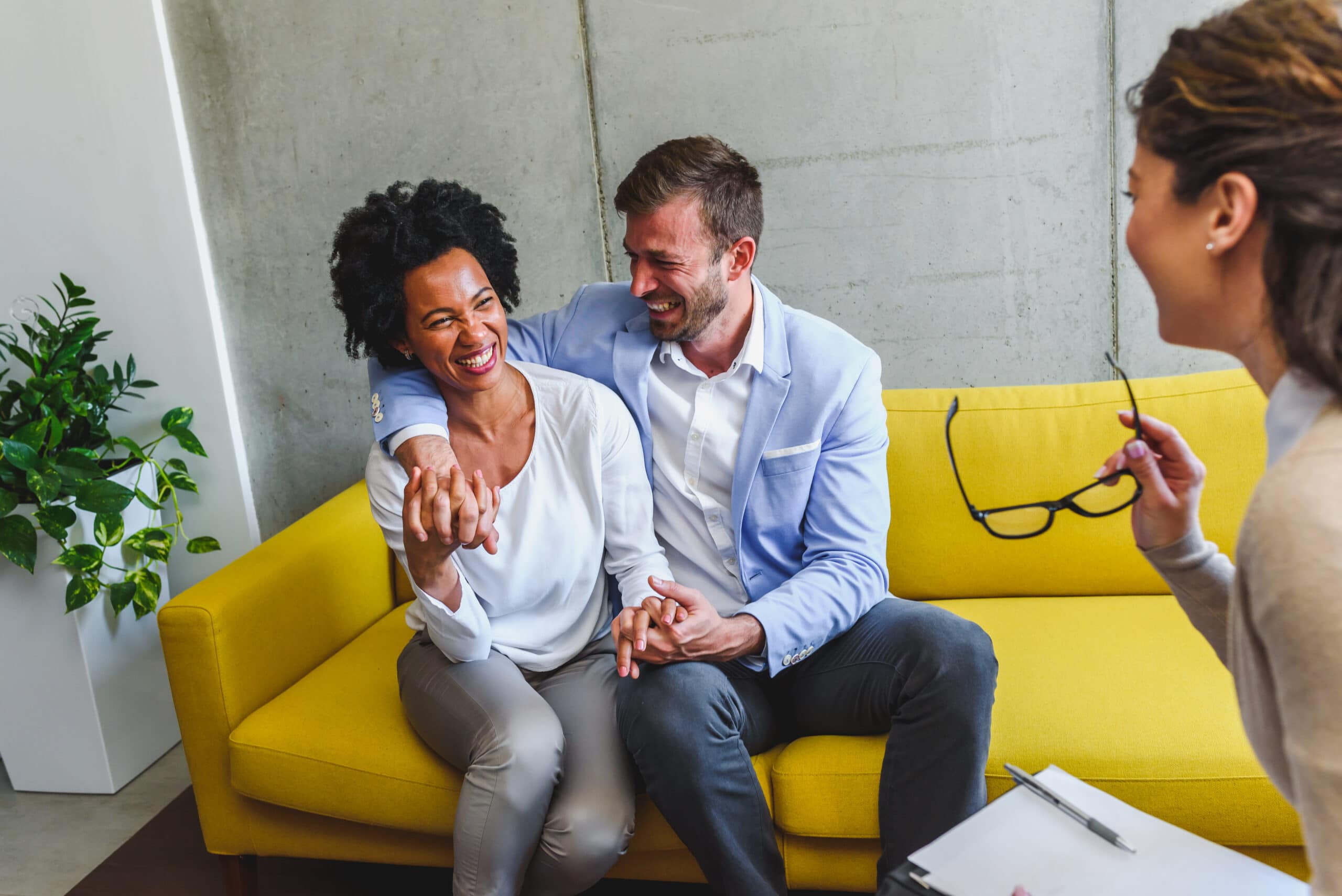 Couple looking happy in counselling